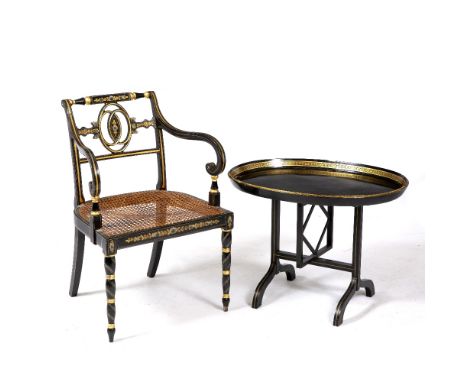 A GEORGIAN STYLE BLACK LACQUERED OPEN ARMCHAIR with parcel gilt and flower decorated decoration, scrolling arms, caned seat a