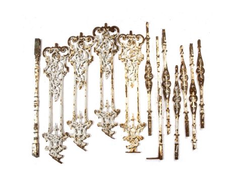A COLLECTION OF 20TH CENTURY PAINTED WROUGHT IRON RAILING OR SUPPORTS of scrolling form, 98cm overall; a cast iron slat brazi