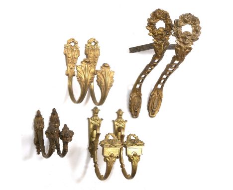 FOUR PAIRS OF GILT METAL CURTAIN TIE BACKS the largest measures 32cm overall (4)