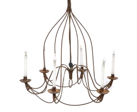 A WROUGHT IRON SIX LIGHT ELECTROLIER OR CHANDELIER with scrolling supports radiating from a central stem, 83cm diameter x 85.