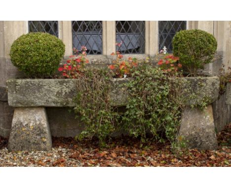 AN OLD ROUGH CUT RECTANGULAR STONE TROUGH 214cm long x 47cm deep x 26cm high standing on stone supports