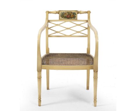 A GEORGIAN STYLE CREAM PAINTED OPEN ARMCHAIR  with flower decorated panel to the back, lattice work horizontal splat, caned s