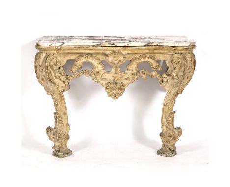 A 19TH CENTURY PAINTED CARVED WOOD MARBLE TOPPED CONSOLE TABLE the serpentine top supported by floral and shell carved frieze