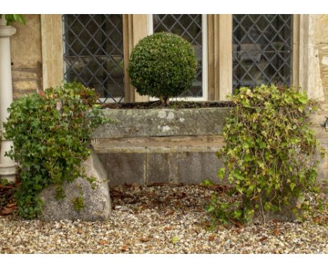 AN OLD ROUGH CUT STONE RECTANGULAR TROUGH 190cm long x 42cm deep x 19cm high standing on stone supports