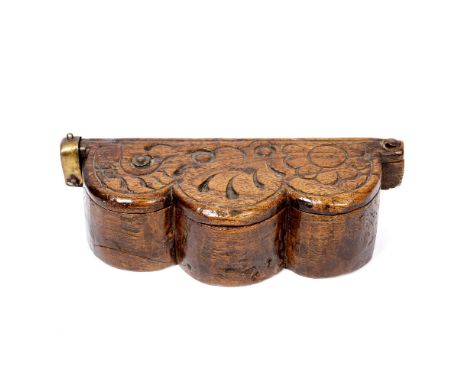A POSSIBLY 17TH CENTURY SHAPED OAK BOX with carved hinged lid, brass hasp and carved interior, possibly originally for either