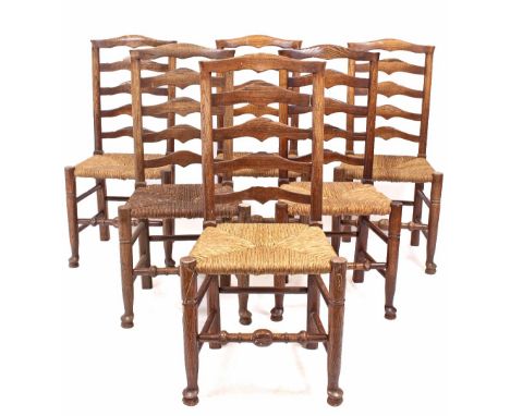 SIX LANCASHIRE STYLE LADDER BACK DINING CHAIRS with rush seats and turned stretchers (6)