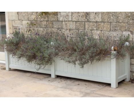A PAINTED WOODEN RECTANGULAR LARGE GARDEN PLANTER with ball finial, 256cm long x 54cm deep x 67cm high