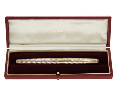 A 9ct gold fountain pen by Parker, engine-turned and with hooded nib, ‘continuous feed’ model, initialled ‘V A R’ and dated ‘