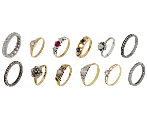 A collection of rings, the majority with stones deficient, including two diamond eternity rings and a further three diamond r