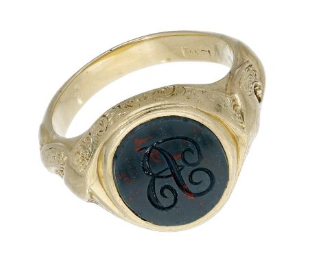 A 19th century seal ring, the oval bloodstone with engraved initial ‘R’, between wraparound shoulders extending to the galler