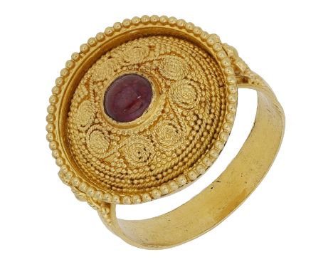 A ruby ring by Lalaounis, the domed circular bezel set with a ruby cabochon and with bead and ropetwist wire decoration throu