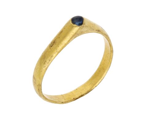 A Medieval gold and sapphire stirrup ring, late 13th century, the hoop of D-shaped cross section, the raised triangular-shape