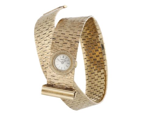 Beuche Girod. A lady’s gold brick link wrap over bracelet watch, circa 1962. Movement: manual winding, 17 jewels. Dial: silve