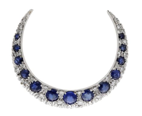 A sapphire and diamond crescent brooch, set throughout with graduated circular-cut sapphires spaced by single-cut diamonds, s