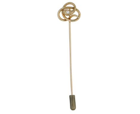 A late 19th century diamond stick pin, designed as a coiled serpent with engraved detailing and an old brilliant-cut diamond 