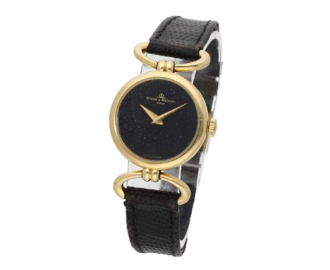 Baume & Mercier. A lady’s gold wristwatch, Ref. 38321, circa 1990. Movement: manual winding, 17 jewels. Dial: black. Case: 18