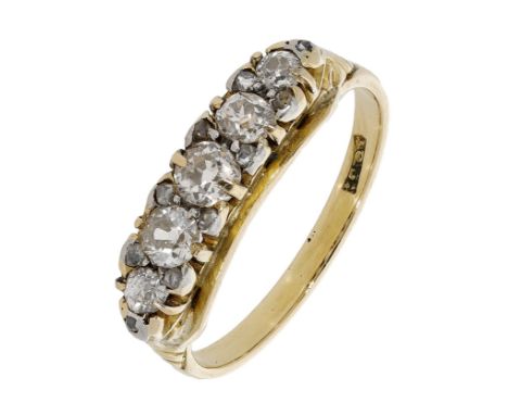 A diamond five stone ring, set with a row of old brilliant-cut diamonds with rose-cut diamond highlights between, stamped ‘18