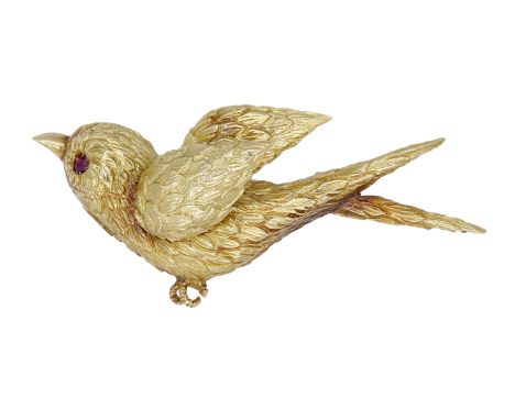 A mid 20th century novelty brooch, French, realistically modelled as a bird in flight, with textured feathers and ruby gem-se