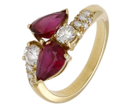 A ruby and diamond ring, of crossover design, the two pear-shaped rubies claw-set to graduated brilliant-cut diamond shoulder