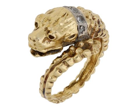 A lion ring possibly by Lalaounis, the textured band of crossover design and terminating in a stylised lion head with brillia