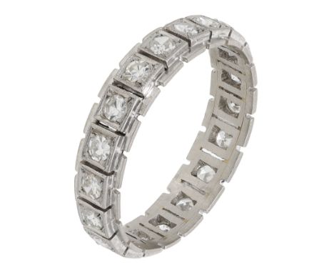 A diamond eternity ring and a sapphire and diamond half eternity ring, the first set throughout with single-cut diamonds, the