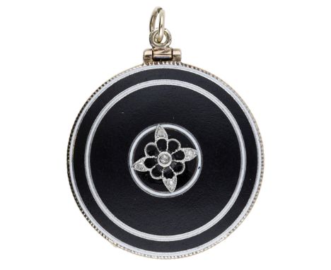 An enamel locket, circa 1900, the circular matte black enamel pendant with white enamel rings to both sides, the front applie