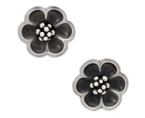 A pair of silver ear studs by Georg Jensen, design No. 67, each realistically modelled as a flowerhead, signed, numbered ‘67’