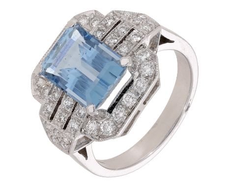 An 18ct white gold aquamarine and diamond dress ring, the step-cut aquamarine claw-set within a surround of brilliant-cut dia