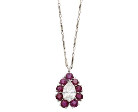 A ruby and diamond pendant, the pear-shaped diamond set within a surround of  circular-cut rubies, the whole suspended by a f