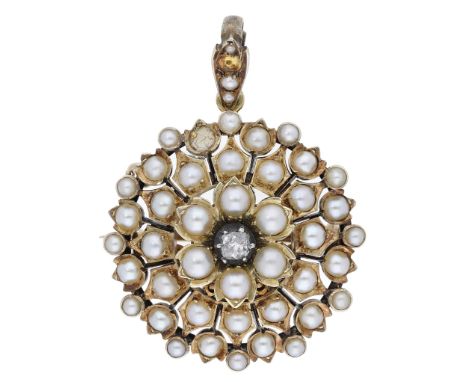 A seed pearl and diamond brooch / pendant, circa 1900, of flowerhead cluster design, set throughout with seed pearls and with