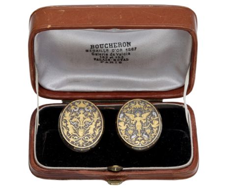 A pair of fine late 19th century French studs by Frédéric Boucheron, the oval damascene steel plaques with highly decorative 