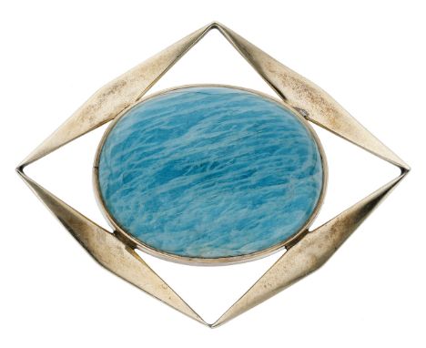 An amazonite brooch, the oval amazonite cabochon collet set within a curved lozenge-shaped frame, stamped ‘9CT’, length appro