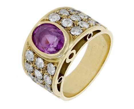 A pink sapphire and diamond dress ring, the tapered band set with an oval mixed-cut pink sapphire between graduated rows of o