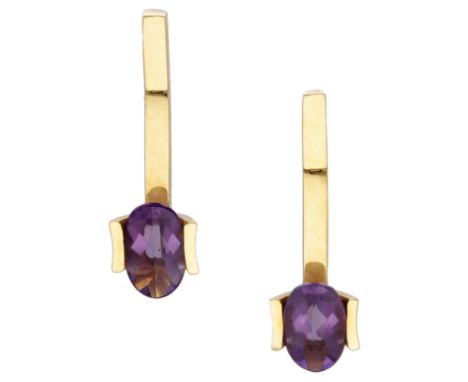 A pair of amethyst earrings, the oval-cut amethysts suspended from articulated polished batons, stamped ‘750’, maker’s mark ‘