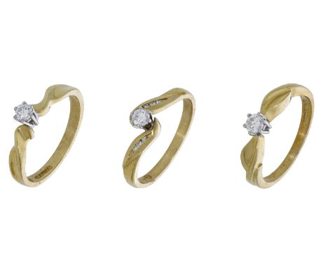 Three 18ct gold and diamond rings, each centred with a brilliant-cut diamond, one of crossover design and inset with diamond 