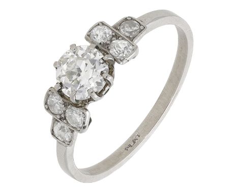 An Art Deco diamond ring, set with an old brilliant-cut diamond between stepped shoulders set with similarly-cut diamonds, st