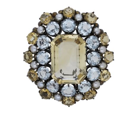 An Arts and Crafts gem-set brooch attributed to Dorrie Nossiter, circa 1930, the step-cut citrine in a cluster surround of ci