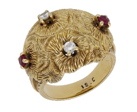 A mid-twentieth century ruby and diamond dress ring, of bombé form, designed as a cluster of flowerheads with brilliant-cut d
