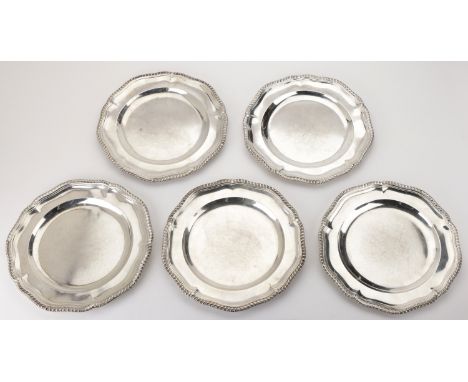 A set of five Victoria silver dinner plates, with gadrooned rims, by Robert Garrard,  London 1858, diameter 25cm. £2,000-£2,2