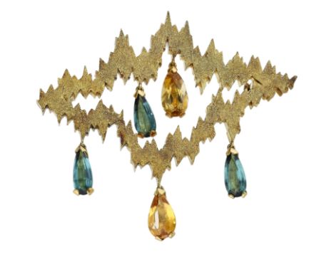 An 18ct gold and gem-set brooch by Andrew Grima, 1970, the textured openwork brooch with jagged outline and suspending a comb