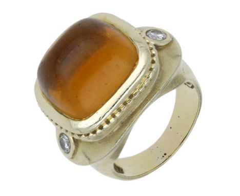 A citrine and diamond dress ring, the sugarloaf citrine cabochon within a ropetwist surround and with brilliant-cut diamond s