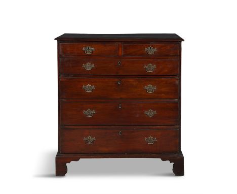 A GEORGE III MAHOGANY CHEST OF DRAWERS,the moulded rectangular top above two short and four long graduated drawers, bracket f