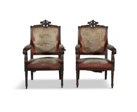 A PAIR OF CONTINENTAL CARVED WALNUT ARMCHAIRS, 19TH CENTURYfitted with tapestry back and seat covers