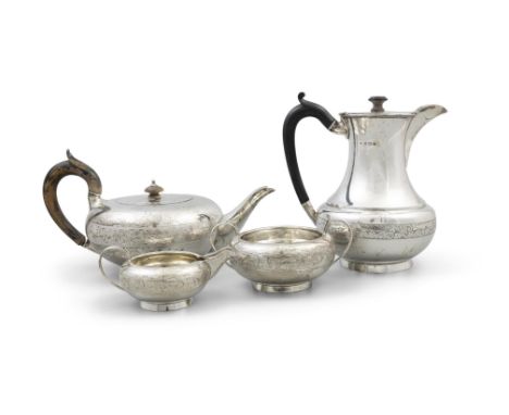 A FOUR PIECE SILVER TEA SERVICE,Birmingham c.1924, comprising: a teapot, hot water pot, cream jug and sugar bowl, of compress