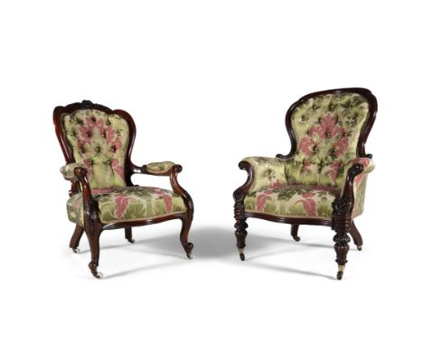 A PAIR OF LADY'S AND GENTLEMAN'S MAHOGANY FRAMED ARMCHAIRS, C.1870, each upholstered in matching button back floral fabric, o