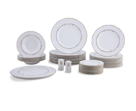 A ROYAL WORCESTER CREAM AND GILT DECORATED PART DINNER SERVICE,comprising of twelve plates, two stands, six soup bowls, twelv