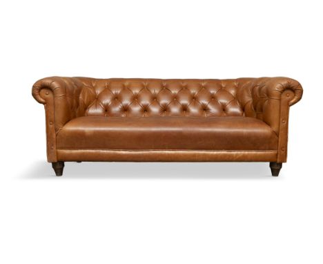 A CHESTERFIELD BUTTON BACK SETTEE, 200cm wide, 75cm highupholstered in brown leather with scroll-end arms, on short cylindric