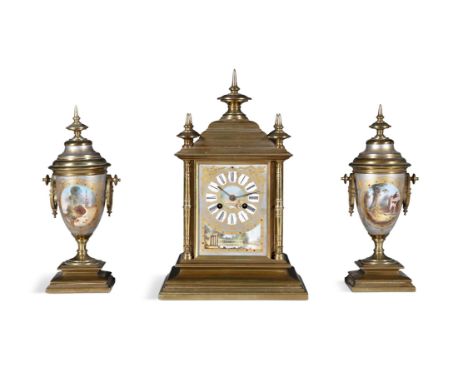 A FRENCH GILT METAL AND PORCELAIN MOUNTED THREE PIECE CLOCK GARNITURE, 19TH CENTURYthe mantle clock of architectural form, su