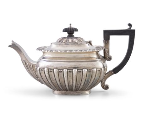A SILVER BACHELOR TEAPOT, Birmingham c.1903, maker's mark probably that of Thomas White, of oblong form, with ebon finial and