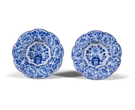 ***PLEASE NOTE: DESCRIPTION SHOULD READ*** A PAIR OF BLUE AND WHITE DELFTWARE DISHES each of shaped circular form, decorated 